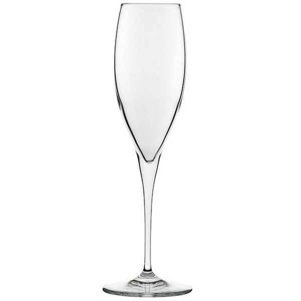 The photograph shows a single, empty champagne flute against a neutral, white background. The glass has a typical long, thin stem that transitions into a round base. The bowl is narrow and cylindrical, lacking the typical tulip-shaped widening. The glass is clear and without decorations.